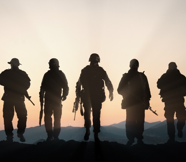 Soldiers walking at sunset